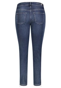 Schmale, dunkelblaue Jeans mit mittelhohem Bund, zwei Gesäßtaschen und einem Reißverschluss am Saum. Hergestellt aus strapazierfähigem Denim-Material.