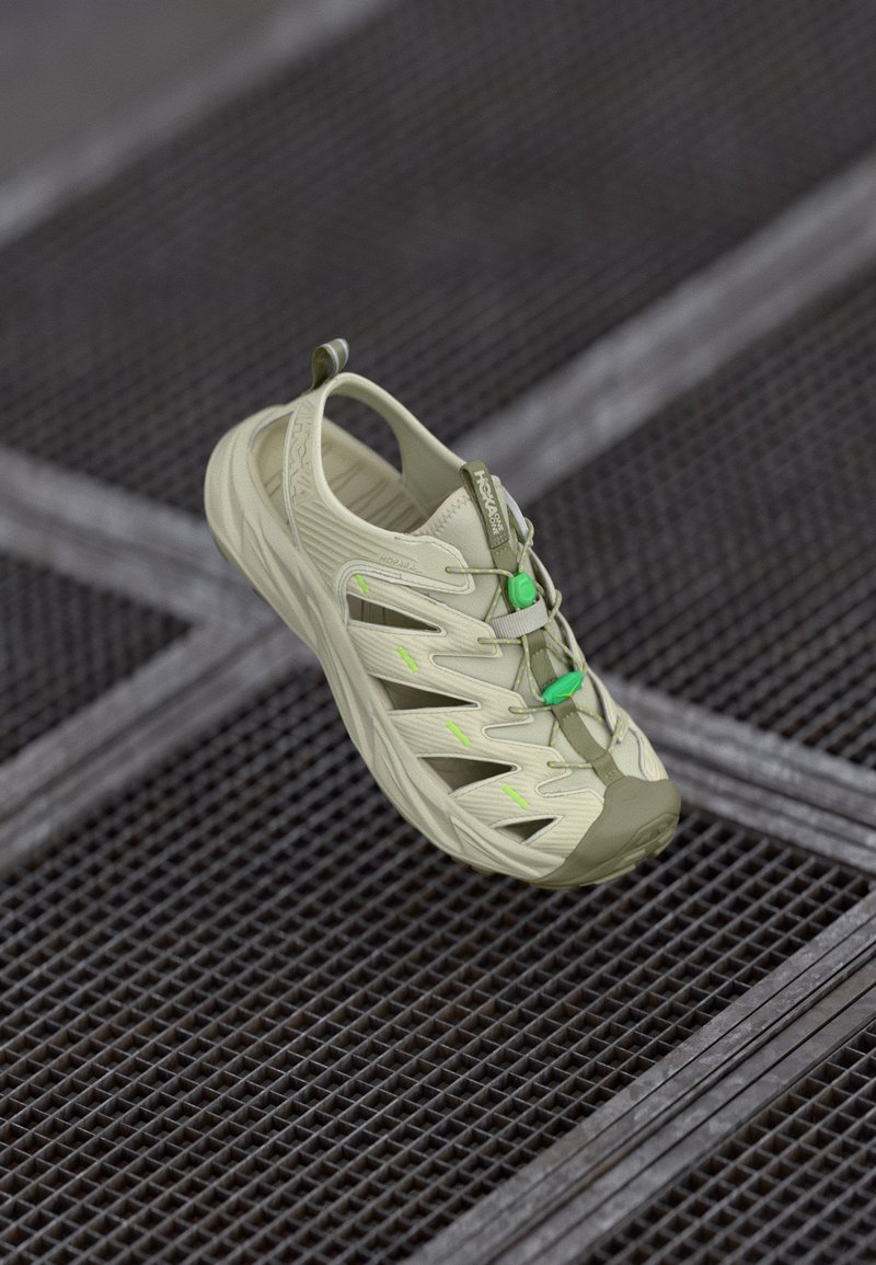 Ανοιχτό πράσινο αθλητικό παπούτσι με ανοιχτό σχεδιασμό πλέγματος, καουτσούκ σόλα, ρυθμιζόμενα κορδόνια και αντίθετες φωσφορούσες πράσινες λεπτομέρειες. Ελαφρύ και αναπνέον.