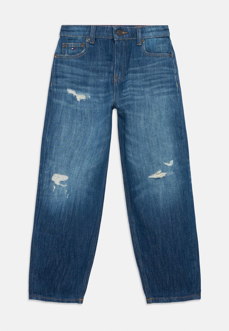 Sinine denim püksid lõdva istuvusega, kulunud laigud mõlemal jalal, klassikaline viie tasku stiil ja nööp sulgemine vööl.