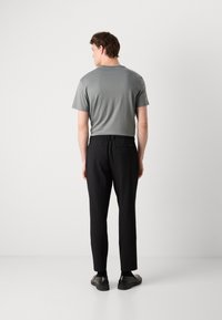 Calvin Klein PULL ON - Trousers - black