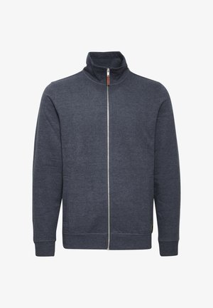 Sötét szürke, zipzáros kapucnis pulóver magas gallérral, oldalsó zsebekkel és bordás mandzsettákkal. Puha, struktúrált anyagból készült.