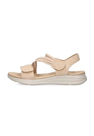 Sandalias de tela beige con correas ajustables, suela acolchada y suela de goma texturizada, que presentan un diseño minimalista y punta abierta.