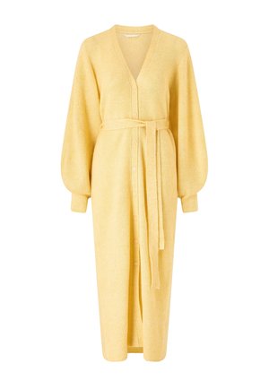 Long yellow knit cardigan with buttons down front, balloon sleeves, and a matching fabric belt tied at the waist.