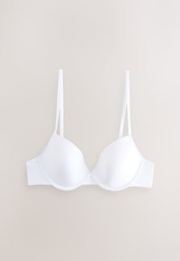 Biały usztywniany biustonosz z regulowanymi cienkimi ramiączkami i fiszbinami, przedstawiony na płasko na jasnobeżowym tle.