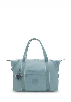 Light blue fabric tote bag with two handles, front zipper pocket, and a small plush keychain attached to one handle.