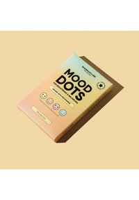 Boîte de patchs pour la peau Mood Dots pour éclairement et équilibrage, avec niacinamide, affichant quatre visages souriants colorés et contenant 48 patchs.