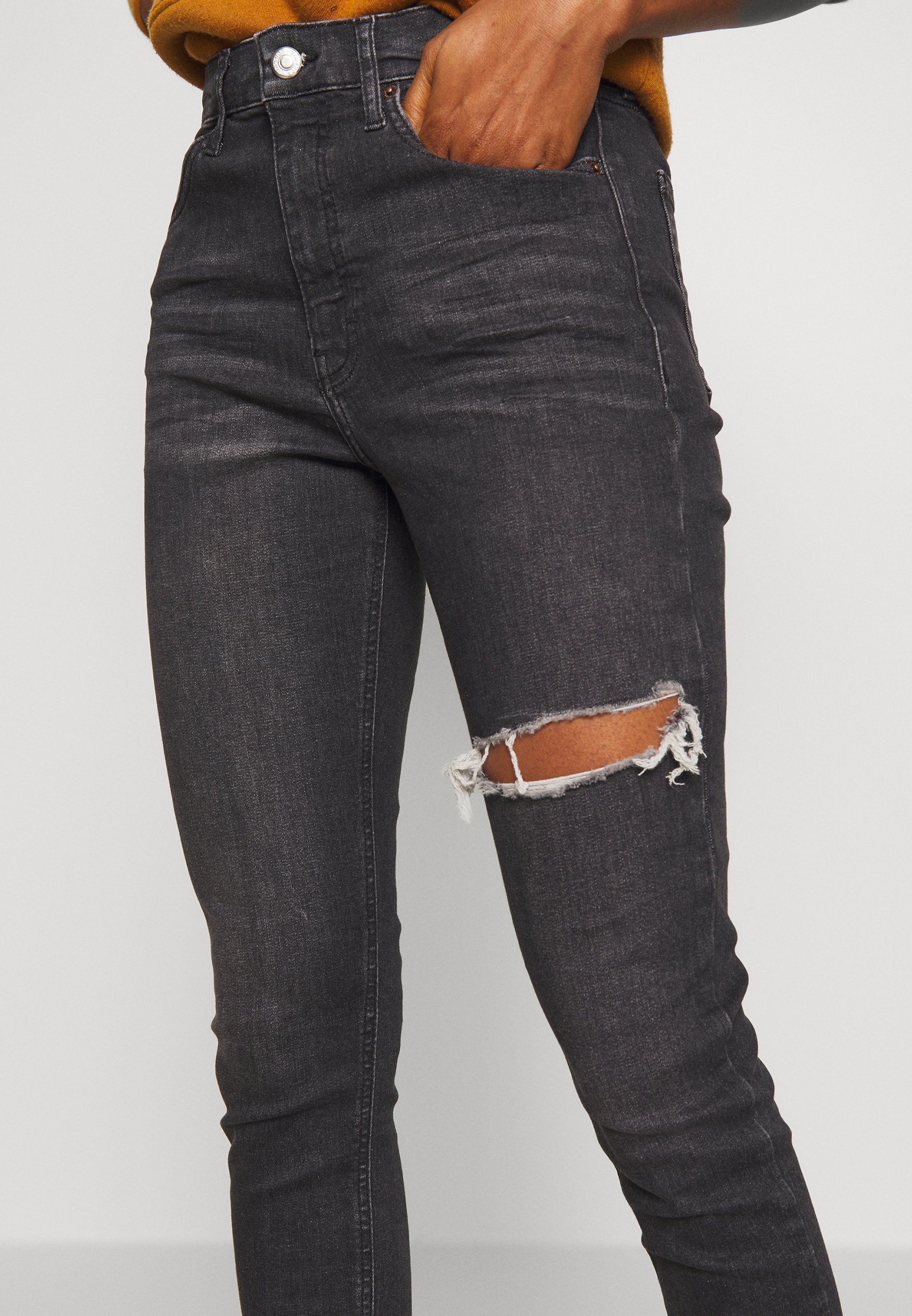 black thigh ripped jeans