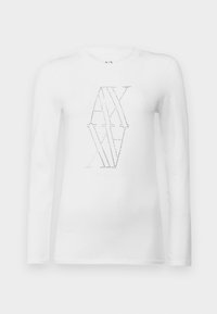 T-shirt bianco a maniche lunghe con scollo rotondo, caratterizzato da un design geometrico in linee puntinate e un testo sottile sotto il grafico.