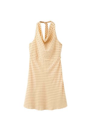 Vestido beige sin mangas con cuello halter, lunares negros y escote drapeado, mostrado sobre un fondo blanco.