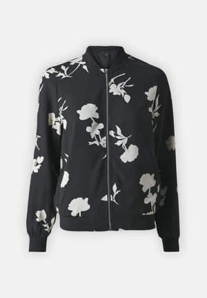 Veste bombardier noire avec des motifs floraux blancs, fermeture éclair à l'avant, poignets et ourlet côtelés. Fabriquée en un tissu lisse et léger.