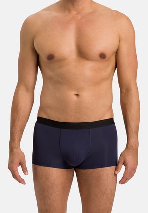 Navy blue boxer briefs with a smooth texture and black elastic waistband. No visible patterns. Featured on a bare torso.