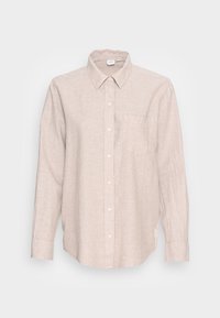 Beige skjorte med lange ærmer i linned, med krave og knapper foran, samt en brystlomme og hvide knapper. Den har en afslappet pasform og tekstureret stof.
