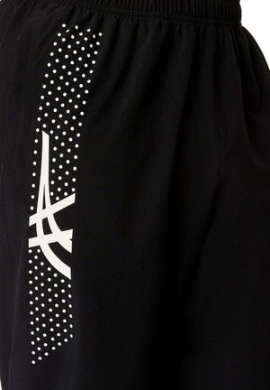 Tessuto nero con striscia verticale di puntini bianchi e audace logo astratto bianco, con elastico in vita sulla parte superiore.