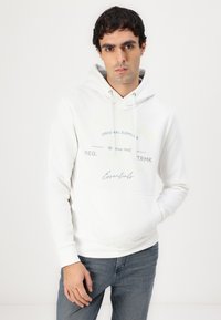 Weißer Kapuzenpullover aus Baumwollmischung mit einer Kängurutasche. Mit gedrucktem Text in Grün und Blau. Rippbündchen und verstellbare Kapuze.