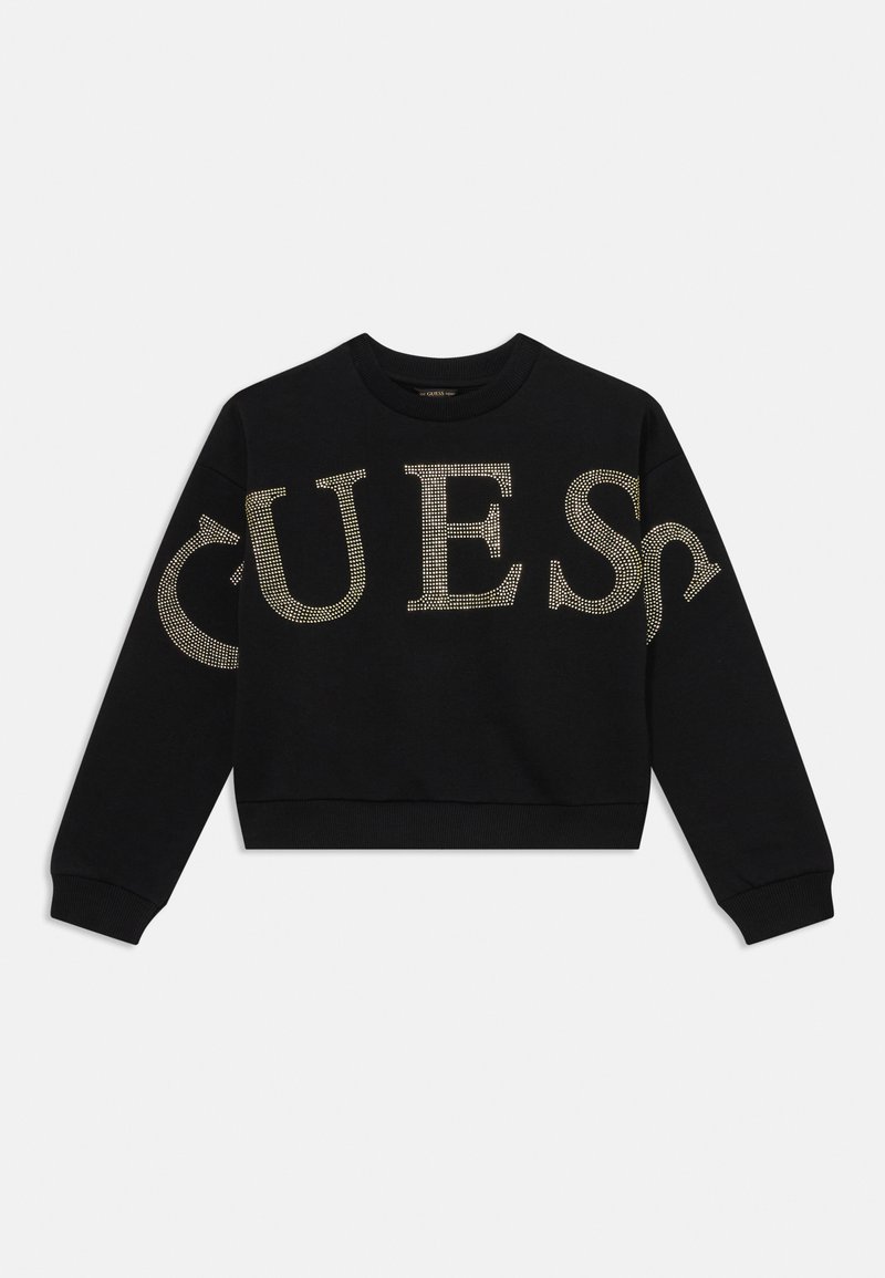 Black cropped sweatshirt with long sleeves, featuring large gold studded "GUESS" lettering across the front. Soft texture and ribbed cuffs.