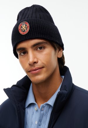 Tommy Hilfiger, LAMBSWOOL BLEND CREST RIB-KNIT BEANIE - Плетена шапка - space blue
