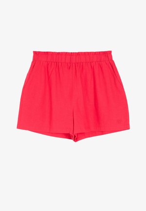 Czerwone lniane szorty z elastycznym paskiem w talii, bocznymi kieszeniami i luźnym krojem. Dołem są proste, bez wyraźnych wzorów czy akcentów.