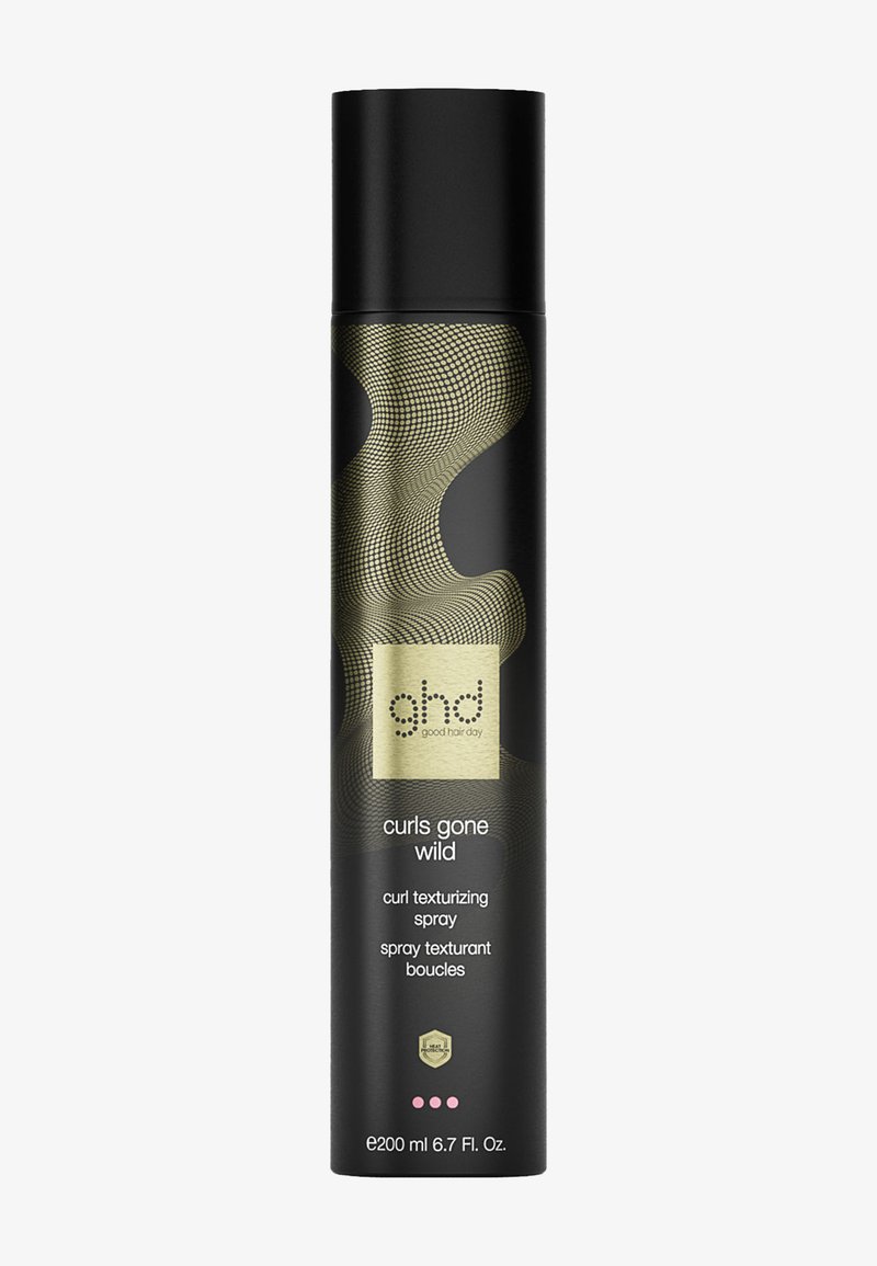 Spray texturisant pour boucles dans un flacon cylindrique noir avec un motif abstrait doré et le logo de la marque. Capacité : 200 ml (6,7 fl. oz.).