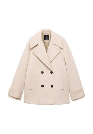 Cappotto doppiopetto beige con ampio colletto a punta, due tasche frontali e bottoni neri. Il tessuto morbido e la vestibilità strutturata esaltano il design.