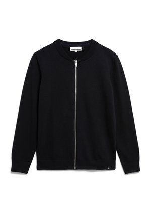 Cardigan nero con zip e colletto rotondo, polsini e orlo a coste. Realizzato in un tessuto a maglia testurizzata, con dettaglio della zip in argento.