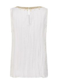 Blouse blanche sans manches en tissu froissé, encolure ronde ornée de petites coquilles beige et fente en forme de goutte à l'avant.