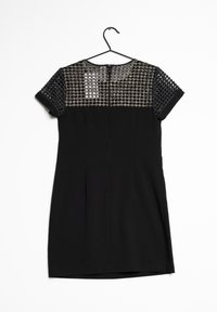 Svart klänning med korta ärmar, med en texturerad meshöverkant och en solid underdel. Dragkedjestängning på baksidan. Slät tyg genom hela klänningen.