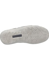Sole of a shoe featuring a textured gray rubber bottom with a zigzag tread pattern and a rectangular label reading "JOSEF SEIBEL."