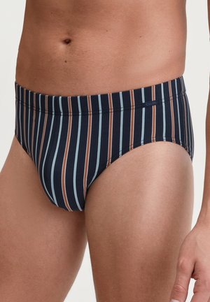 Herren-Schwimmslips in navyblau mit vertikalen Streifen in Braun und Hellblau. Weicher Stoff, elastischer Bund und enganliegendes Design.