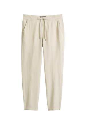 Pantaloni casual beige con vita elasticizzata, coulisse, tasche laterali e gambe dritte, disposti su una superficie bianca.