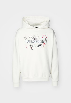 Balta gobtuvė su grafika priekyje, kurios dizainas apima spalvų pliūpsnius: rožinę, geltoną ir juodą. Apvali virvelė, raštuoti rankogaliai ir apatinė dalis.