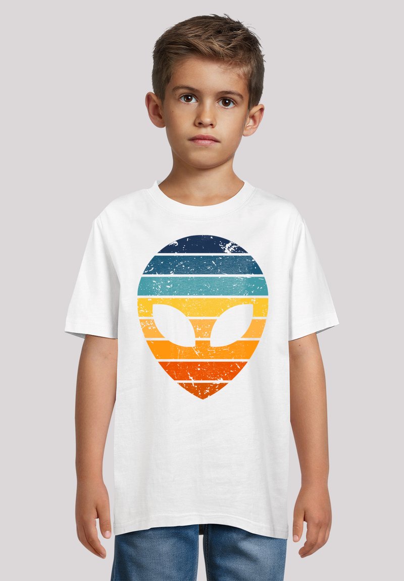 White cotton t-shirt featuring a textured alien head graphic with horizontal stripes in dark blue, light blue, orange, and yellow hues.