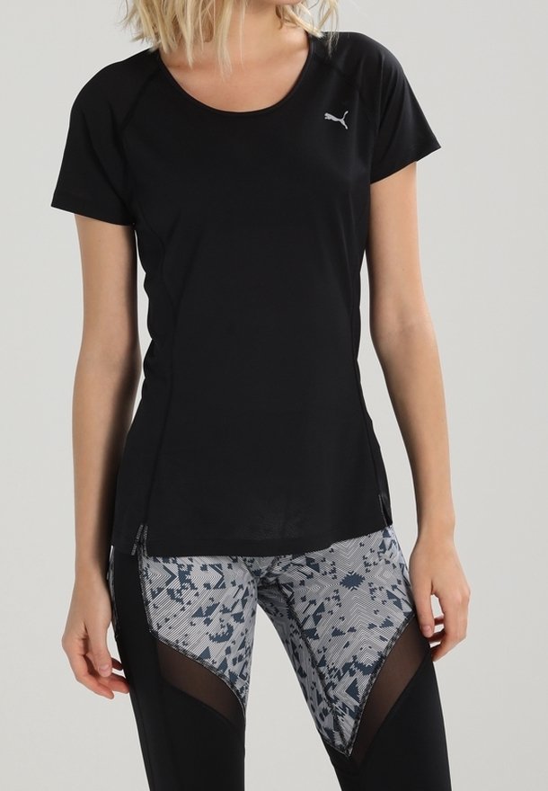 Black short-sleeve athletic shirt with a logo on the chest, paired with patterned, stretchy leggings featuring mesh panels.