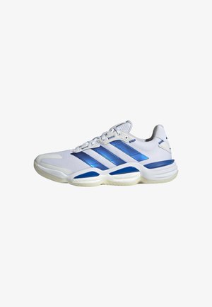 White athletic shoes with blue accents, textured mesh upper, three stripes logo, padded collar, and thick rubber soles for support.