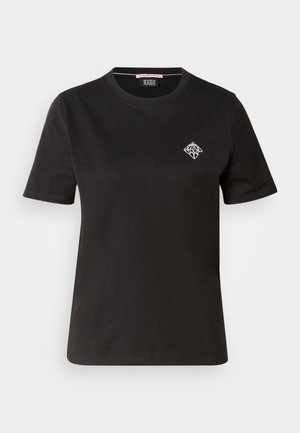 T-shirt in cotone nero con scollatura rotonda, maniche corte e un piccolo design grafico bianco sulla parte sinistra del petto.