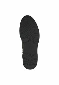 Black rubber sole with a textured tread featuring zigzag patterns. The design is flat with a rounded tip and a logo embossed in the center.