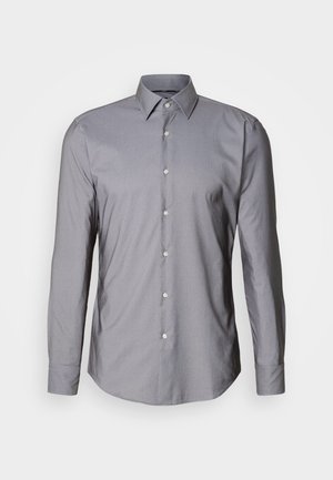 Szara, długorękawowa koszula zapinana na guziki z wyprofilowanym kołnierzykiem, z przodu zapięciem na guziki i gładką fakturą. Posiada lekko taliowany krój.