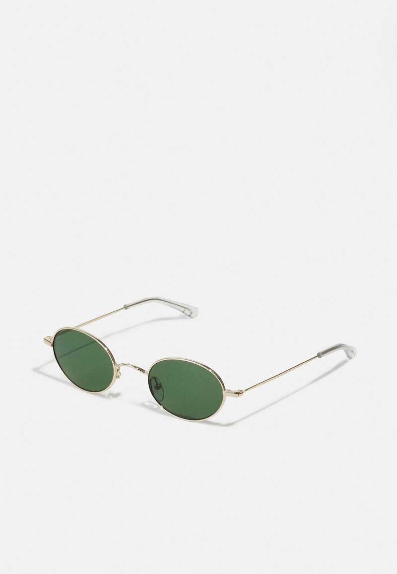 Gold-framed sunglasses with green oval lenses and thin metal arms. Features clear plastic tips on the arms for comfort.
