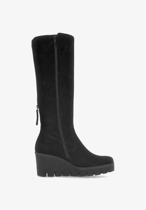 Botte noire en suède jusqu'au genou avec un talon épais. Dispose d'une fermeture éclair latérale pour un enfilage facile et d'une semelle texturée pour une meilleure adhérence.