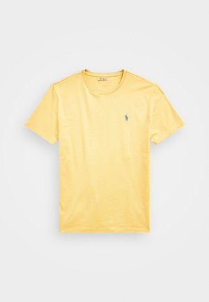 Gele T-shirt met korte mouwen en ronde hals, met een klein blauw geborduurd Polo Ralph Lauren-logo op de linkerborst.