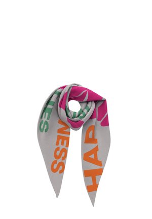 Light gray triangular scarf with large orange, green, and pink letters forming words and a floral pattern, folded in a spiral shape.