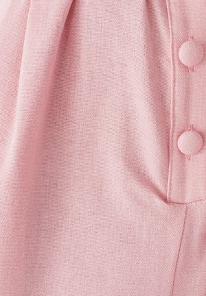 Light pink fabric with a textured weave, featuring a button detail in a smooth finish, and soft pleating along the edge.