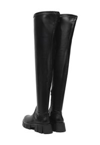 Czarne skórzane buty za kolano z masywnymi podeszwami i bocznymi zamkami, pokazane z tylnego kąta na białym tle.