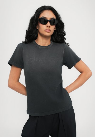 Black cotton t-shirt with a crew neck, featuring embossed "HELMUT LANG" logo on the front. Short sleeves and a relaxed fit.