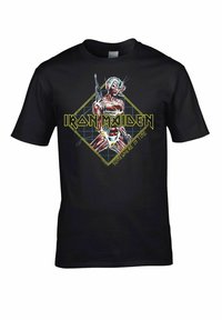 Černé bavlněné tričko se znakem postavy se zbraní. Na tričku je text "IRON MAIDEN" a "SOMEWHERE IN TIME" v žluté barvě.