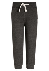 Grijze trainingsbroek met een elastische tailleband, verstelbaar trekkoord en taps toelopende pijpen; zachte textuur en zijzakken.