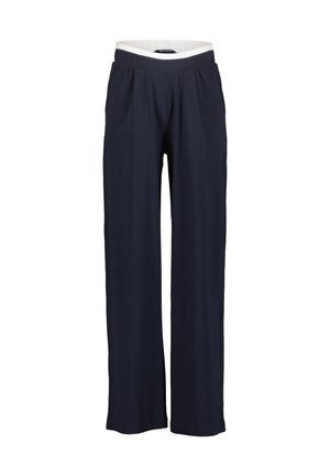 Marineblaue, weite Hose mit elastischem Bund und weißem Innenfutter, vorn mit Falten und einem lockeren Schnitt.