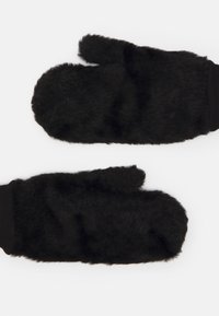 Sorte, fuzzy vanter med en blød tekstur og et hyggeligt design, der har en ribbet sort manchette for en tætsiddende pasform.