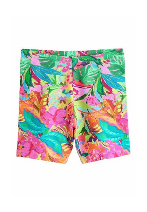 Lyse tropiske shorts med grønne, blå, pink og orange blade og blomster på en pink baggrund.