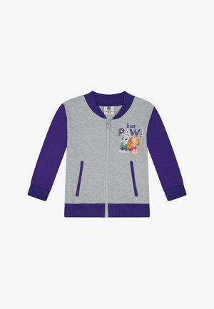 Veste grise zippée avec manches et poignets violets. Le devant présente le texte "Team PAW!" ainsi que des graphiques de personnages. Deux poches latérales incluses.