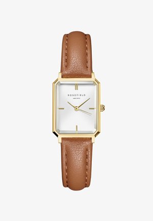 Montre Rosefield avec un cadran blanc rectangulaire, des accents dorés et un bracelet en cuir brun texturé. Présente un design minimaliste et des index horaires élégants.